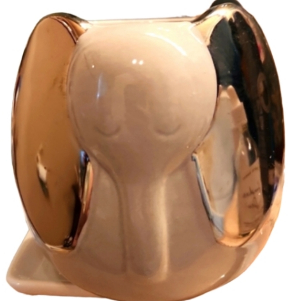 Elephant jar. Has mirrored chrome ears. Cup sized, heavy durable